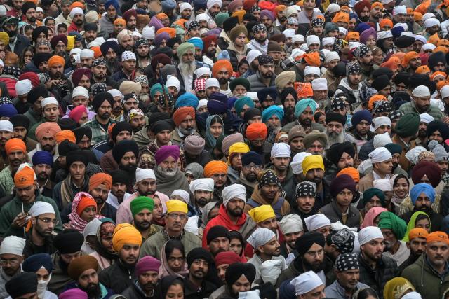 Sikh devotees gather to pray at the Golden Temple on New Year's Day in Amritsar on January 1, 2026. (Photo by Narinder NANU / AFP)