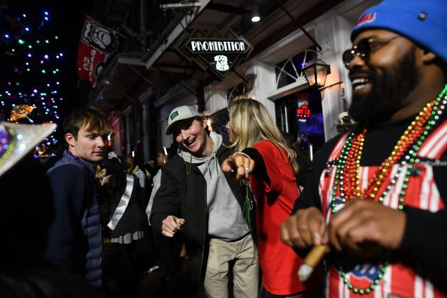 Partygoers celebrate the New Year at the French Quarter in New Orleans, Louisiana, on January 1, 2026. (Photo by Octavio JONES / AFP)