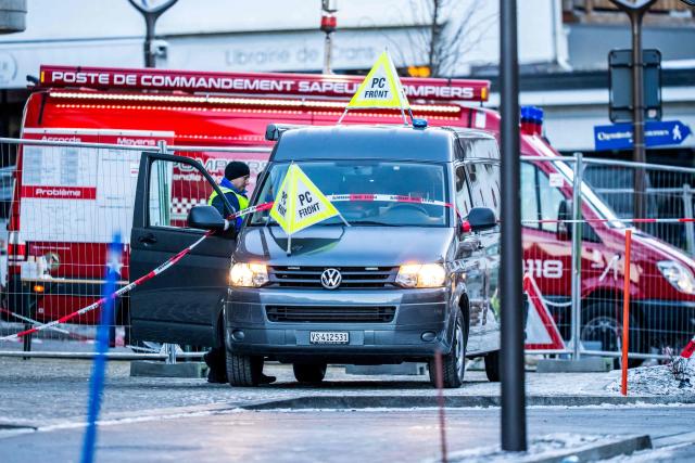 An ambulance is seen at the site of an explosion that ripped through a bar in Crans-Montana on January 1, 2026. Several people were killed and others injured when an explosion ripped through a bar in the luxury Alpine ski resort town of Crans Montana, Swiss police said early on January 1. (Photo by MAXIME SCHMID / AFP)