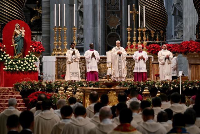 Pope Leo XIV (C) presides over a Holy Mass for the Solemnity of Mary Mother of God as part of the New Year's celebrations in St. Peter's Basilica, at the Vatican, on January 1, 2026. (Photo by Alberto PIZZOLI / AFP)