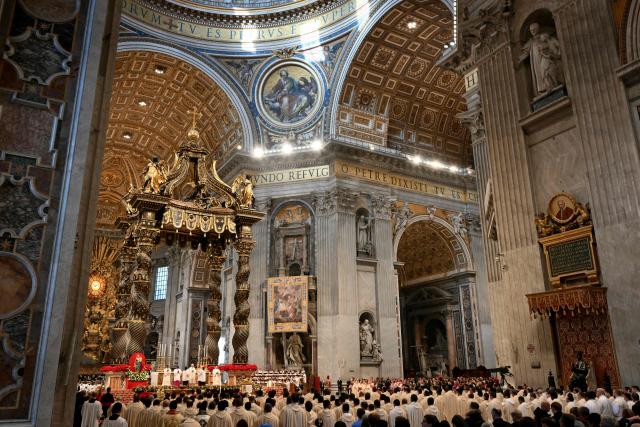 Faithfull listen to Pope Leo XIV during a Holy Mass for the Solemnity of Mary Mother of God as part of the New Year's celebrations in St. Peter's Basilica, at the Vatican, on January 1, 2026. (Photo by Alberto PIZZOLI / AFP)