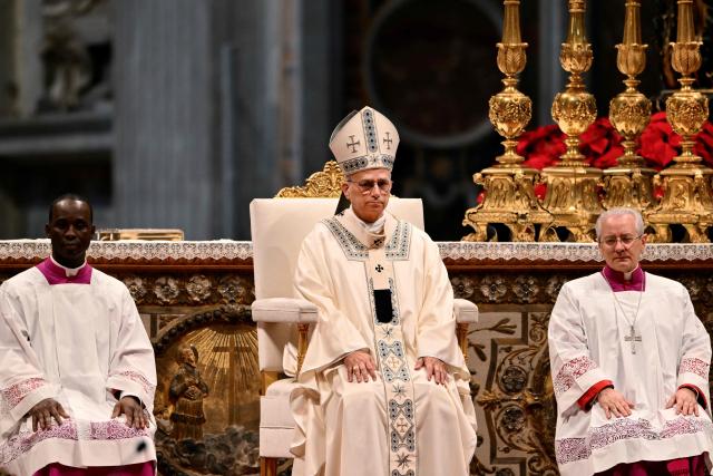 Pope Leo XIV (C) presides over a Holy Mass for the Solemnity of Mary Mother of God as part of the New Year's celebrations in St. Peter's Basilica, at the Vatican, on January 1, 2026. (Photo by Alberto PIZZOLI / AFP)