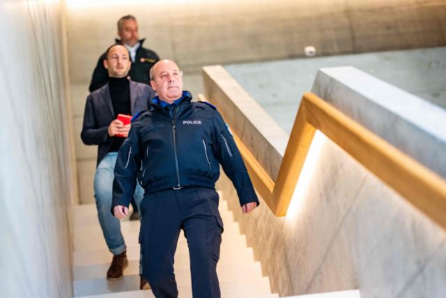 Frederic Gisler, commander of the Valais cantonal police, arrives for a press conference following an explosion that ripped through a bar in the luxury Alpine ski resort town of Crans-Montana on January 1, 2026. Several people were killed and others injured when an explosion ripped through a bar in the luxury Alpine ski resort town of Crans-Montana, Swiss police said early on January 1. (Photo by MAXIME SCHMID / AFP)