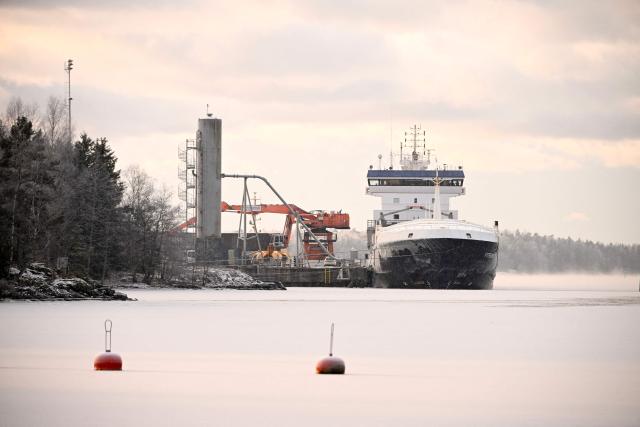 The seized vessel Fitburg is moored at the harbour in Kirkkonummi, Finland, on January 1, 2026. Finnish police said they had seized a vessel suspected of damaging a telecommunications cable that runs between Helsinki and Tallinn in the Gulf of Finland. The Finnish coast guard identified the vessel as the Fitburg, a 132-meter-long cargo ship bearing a flag from St Vincent and Grenadines, en route from St Petersburg, Russia, to Haifa, Israel. Fourteen crew members from Russia, Georgia, Azerbaijan and Kazakhstan were detained and were to be questioned. (Photo by Roni Rekomaa / Lehtikuva / AFP) / Finland OUT