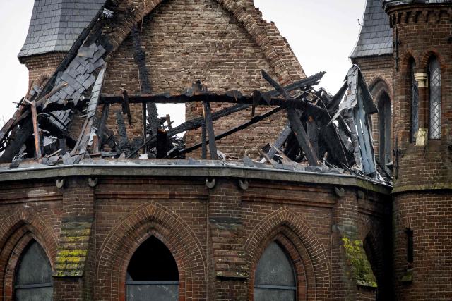 A photograph taken on January 1, 2026 shows the damage on the tower of the Vondelkerk church in Amsterdam, following a fire. (Photo by Koen van Weel / ANP / AFP) / Netherlands OUT