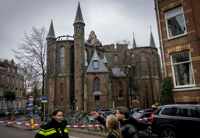 A photograph taken on January 1, 2026 shows the Vondelkerk church after one of the tower caught fire, during New Year's Eve, in Amsterdam. A huge inferno gutted a 19th century Amsterdam church, as the Netherlands endured an unsettled New Year's Eve with two dead from fireworks and "unprecedented" violence against police. (Photo by Koen van Weel / ANP / AFP) / Netherlands OUT