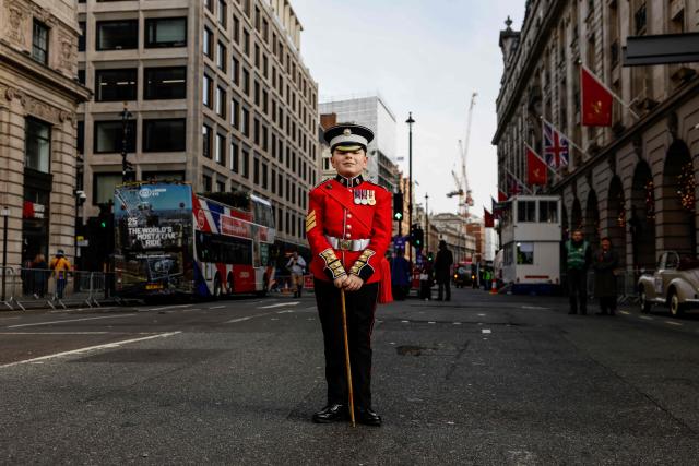 A participant poses as people prepare to take part in the annual New Year's Day parade, ahead of the start in Green Park in Central London on January 1, 2026. (Photo by Brook Mitchell / AFP)