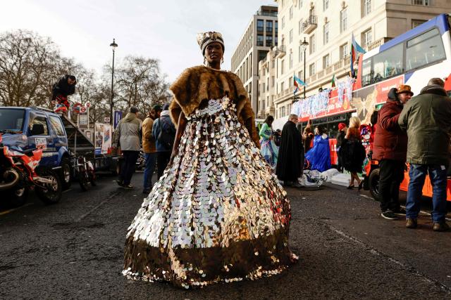 A participant poses as people prepare to take part in the annual New Year's Day parade, ahead of the start in Green Park in Central London on January 1, 2026. (Photo by Brook Mitchell / AFP)