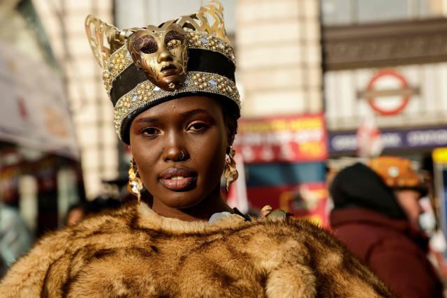 A participant poses as people prepare to take part in the annual New Year's Day parade, ahead of the start in Green Park in Central London on January 1, 2026. (Photo by Brook Mitchell / AFP)