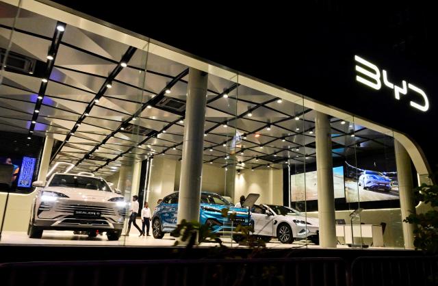 (FILES) A general view shows a showroom for BYD's electric vehicles in Colombo on July 30, 2025. Chinese auto giant BYD sold 2.26 million electric vehicles last year, a company statement at the Hong Kong Stock Exchange showed on January 1, 2026, setting a new record for any firm globally. (Photo by Ishara S. KODIKARA / AFP)