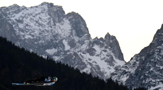Slovenia's Zak Mogel competes during the Men's Individual Large Hill HS142 event of the FIS Ski Jumping World Cup, the second leg of the Four Hills Tournament, in Garmisch-Partenkirchen, southern Germany on January 1, 2026. (Photo by PHILIPP GUELLAND / AFP)