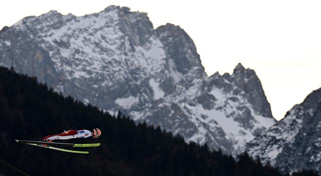 Austria's Jan Hoerl competes during the Men's Individual Large Hill HS142 event of the FIS Ski Jumping World Cup, the second leg of the Four Hills Tournament, in Garmisch-Partenkirchen, southern Germany on January 1, 2026. (Photo by PHILIPP GUELLAND / AFP)