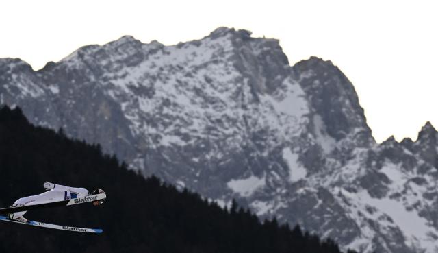Switzerland's Juri Kesseli competes during the Men's Individual Large Hill HS142 event of the FIS Ski Jumping World Cup, the second leg of the Four Hills Tournament, in Garmisch-Partenkirchen, southern Germany on January 1, 2026. (Photo by PHILIPP GUELLAND / AFP)
