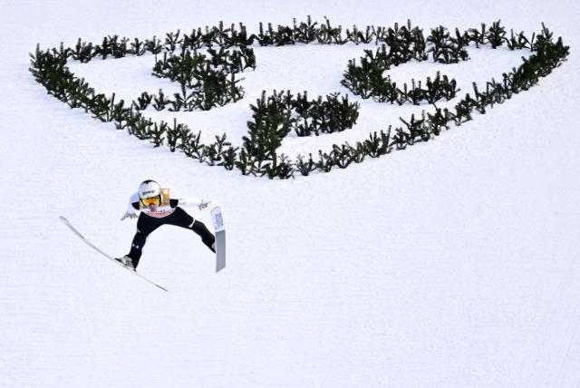 Slovenia's Domen Prevc competes to win the Men's Individual Large Hill HS142 event of the FIS Ski Jumping World Cup, the second leg of the Four Hills Tournament, in Garmisch-Partenkirchen, southern Germany on January 1, 2026. (Photo by PHILIPP GUELLAND / AFP)
