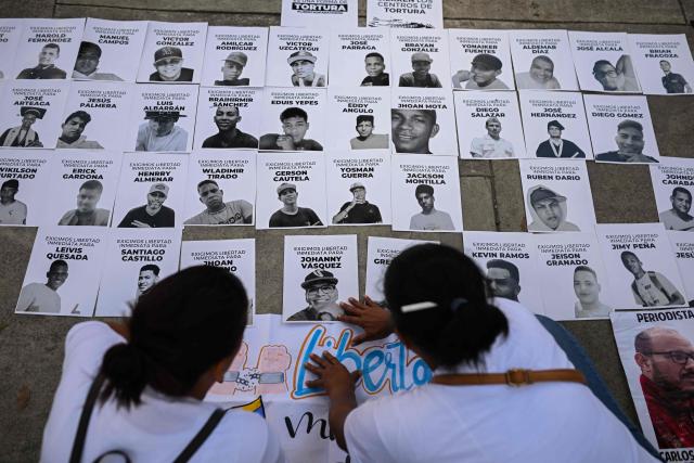 (FILES) Relatives of people detained during protests following the disputed July 28 presidential elections and of other political prisoners take part in a demonstration demanding their release in front of the Public Prosecutor's Office in Caracas on November 21, 2024. At least 87 people detained in demonstrations following Nicolas Maduro's re-election in the 2024 presidential elections, which the opposition denounced as fraudulent, were released from prison on January 1, 2026 in Venezuela, according to two NGOs. (Photo by Federico PARRA / AFP)