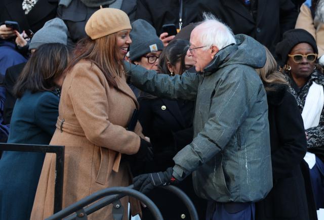 New York Attorney General Letitia James greets US Senator Bernie Sanders, Independent of Vermont, as they attend New York Mayor Zohran Mamdani's public inauguration ceremony followed by a block party at City Hall in New York on January 1, 2026. Mamdani, the young upstart of the US left, was sworn in Thursday to take over as New York mayor for a term sure to see him cross swords with President Donald Trump. After the clocks struck midnight, bringing in 2026, Mamdani took his oath of office at an abandoned subway stop to begin managing the United States' largest city. He is New York's first Muslim mayor. (Photo by ANGELA WEISS / AFP)
