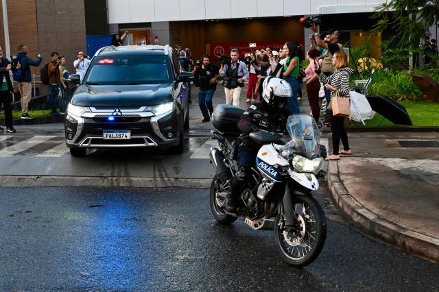 A Federal Police convoy escorting former Brazil's President (2019-2023) Jair Bolsonaro leaves the DF Star Hospital, where he underwent inguinal hernia surgery and a phrenic nerve block procedure, in Brasilia on January 1, 2026. (Photo by Evaristo Sa / AFP)