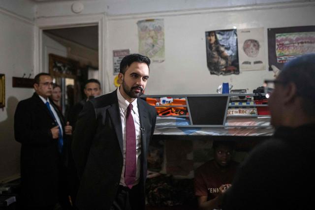 New York Mayor Zohran Mamdani meets with Nadege Romulus (R) as he visits her apartment in the Prospect Lefferts Gardens neighborhood of Brooklyn, New York, January 1, 2026, on his first day in office. Mamdani, the young upstart of the US left, was sworn in January 1 to take over as New York mayor for a term sure to see him cross swords with President Donald Trump. After the clocks struck midnight, bringing in 2026, Mamdani took his oath of office at an abandoned subway stop to begin managing the United States' largest city. He is New York's first Muslim mayor. (Photo by Dave Sanders / POOL / AFP)