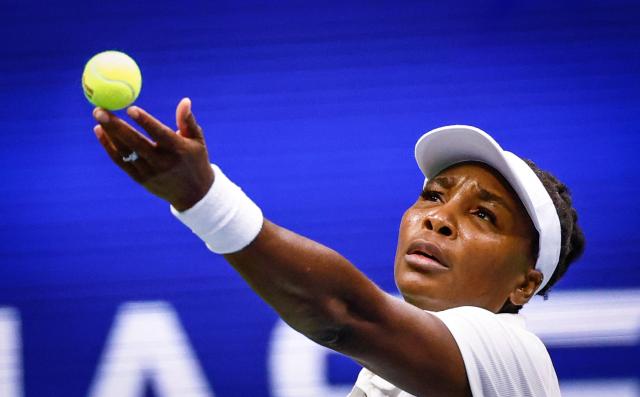(FILES) USA's Venus Williams serves to Czech Republic's Karolina Muchova during their women's singles first round tennis match on day two of the US Open tennis tournament at the USTA Billie Jean King National Tennis Center in New York City, on August 25, 2025. Seven-time major singles champion Venus Williams was handed a wildcard to the Australian Open aged 45 on January 2, 2025, becoming the oldest woman ever to play at the season-opening Grand Slam. (Photo by Kena Betancur / AFP)
