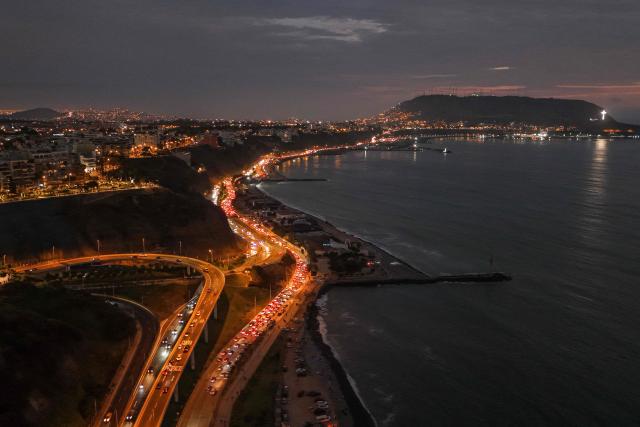 This aerial view shows the beach circuit of "Playas de la Costa Verde" and "La Pampilla" during the night in Miraflores, Lima, on January 1, 2025. (Photo by Connie FRANCE / AFP)