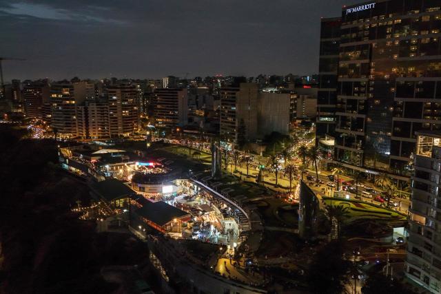This aerial view shows the shopping center "Larcomar" during the sunset in Miraflores, Lima, on January 1, 2025. (Photo by Connie FRANCE / AFP)