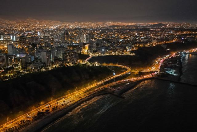 This aerial view shows the beach circuit of "Playas de la Costa Verde" and "La Pampilla" during the night in Miraflores, Lima, on January 1, 2025. (Photo by Connie FRANCE / AFP)
