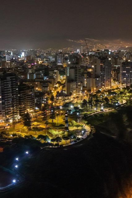 This aerial view shows the park "El Faro" during the night in Miraflores, Lima, on January 1, 2025. (Photo by Connie FRANCE / AFP)