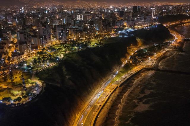 This aerial view shows the park "El Faro" during the night in Miraflores, Lima, on January 1, 2025. (Photo by Connie FRANCE / AFP)