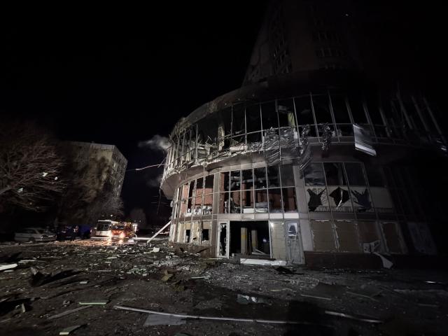 This photograph shows a damaged residential building following a Russian drone strike in Zaporizhzhia on January 2, 2026, amid the Russian invasion of Ukraine. (Photo by Darya NAZAROVA / AFP)
