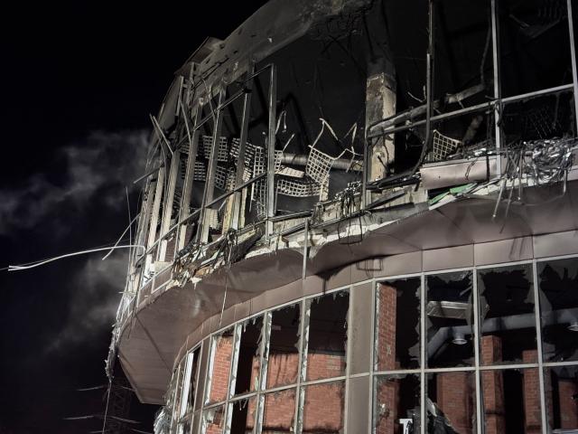 This photograph shows a damaged residential building following a Russian drone strike in Zaporizhzhia on January 2, 2026, amid the Russian invasion of Ukraine. (Photo by Darya NAZAROVA / AFP)