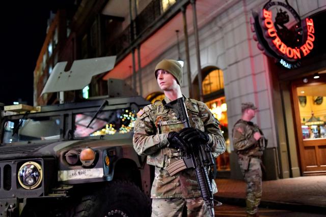 Members of the Louisiana National Guard stand watch in the French Quarter as authorities anticipate large crowds in New Orleans, Louisiana, early morning on January 2, 2026. (Photo by Octavio JONES / AFP)