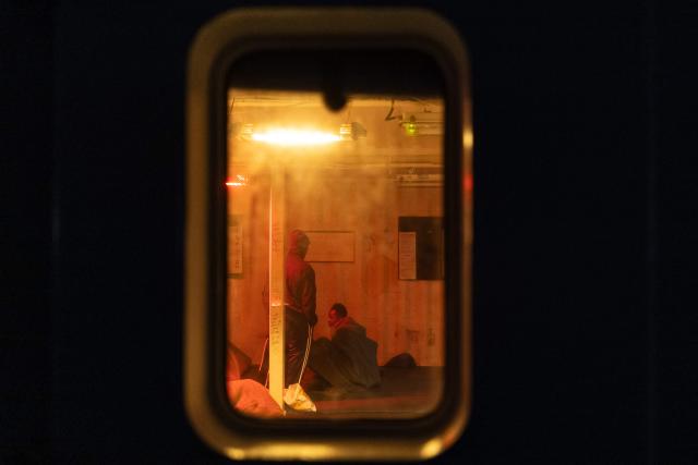Migrants rest at the men's shelter onboard the rescue ship "Ocean Viking" operated by humanitarian NGO SOS Mediterranee, in the Mediterranean Sea near the Italian coast on January 2, 2026. 33 migrants were rescued by crew members of the migrants rescue ship "Ocean Viking" operated by the NGO SOS Mediterranee. They had been stranded on the oil tanker the 'Maridive 703' since their initial rescue 5 days ago in the joint search zone between Malta and Tunisia in international Mediterranean waters. (Photo by Sameer Al-DOUMY / AFP)