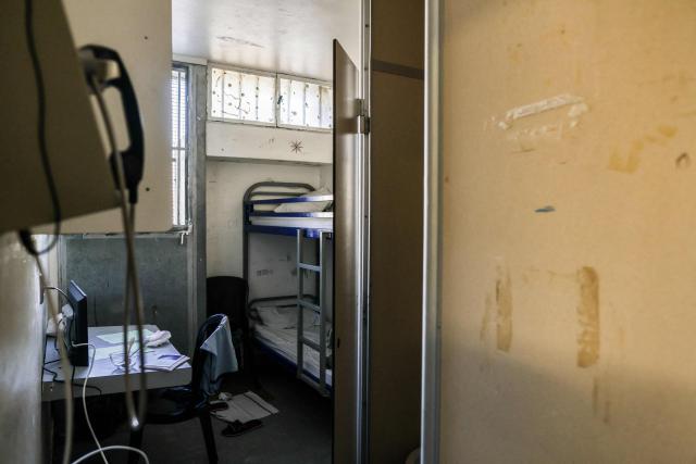 (FILES) A cell of the arrivals section of Gradignan prison is pictured, near Bordeaux, southwestern France, on October 3, 2022. There were 86,229 inmates in French prisons on December 1, 2025, marking another monthly increase amid chronic prison overcrowding, according to data published on January 2, 2026, by France's Ministry of Justice. (Photo by Thibaud MORITZ / AFP)
