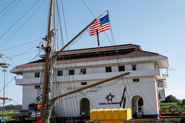 (FILES) One of the three masts of he US Coast Guard training vessel Eagle is pictured as it passes through the Miraflores Locks of the Panama Canal en route to the Pacific Ocean in Panama City on April 23, 2025. Panama’s president, Jose Raul Mulino, declared the crisis with the United States over on January 2, 2026, after Donald Trump threatened in 2025 to reclaim the interoceanic canal on the grounds that it was supposedly controlled by China. (Photo by MARTIN BERNETTI / AFP)