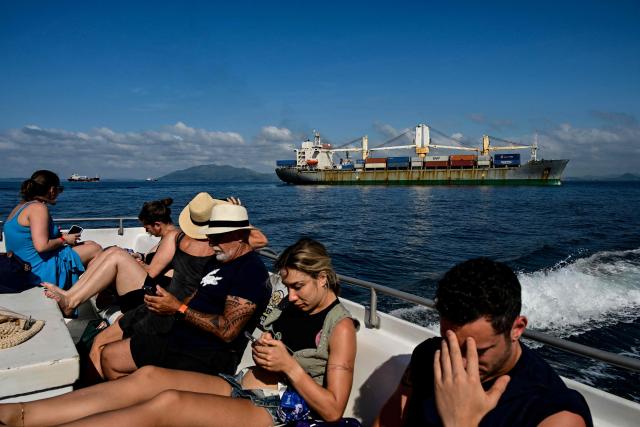 (FILES) A cargo ship waits its turn to cross the Panama Canal in Panama City, on December 30, 2025. Panama’s president, Jose Raul Mulino, declared the crisis with the United States over on January 2, 2026, after Donald Trump threatened in 2025 to reclaim the interoceanic canal on the grounds that it was supposedly controlled by China. (Photo by MARTIN BERNETTI / AFP)