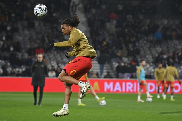 Lens' Burkinabe defender #37 Ismaelo Ganiou heads the ball during the warm up ahead of the French L1 football match between Toulouse FC and RC Lens at the TFC Stadium in Toulouse, southwestern France, on January 2, 2026. (Photo by Matthieu RONDEL / AFP)
