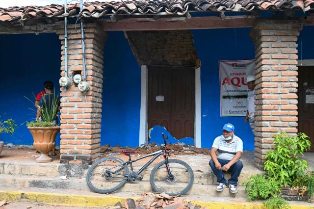 A man sits in front of a damaged house after a 6.5 magnitude earthquake in the community of San Marcos, Guerrero state, Mexico on January 2, 2026. A 6.5-magnitude earthquake rattled Mexico's capital and a tourist hotspot on  the Pacific coast on Friday, killing at least one person but causing no serious damage. (Photo by Francisco ROBLES / AFP)