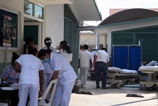 Nurses evacuate patients at the regional hospital after a 6.5 magnitude earthquake  in the community of San Marcos, Guerrero state, Mexico on January 2, 2026. A 6.5-magnitude earthquake rattled Mexico's capital and a tourist hotspot on  the Pacific coast on Friday, killing at least one person but causing no serious damage. (Photo by Francisco ROBLES / AFP)