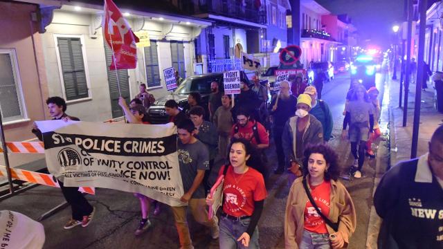 Protesters march through the French Quarter during a "No Trump, No Troops" rally against President Trump's immigration policies and Louisiana Governor Jeff Landry's National Guard deployment, in New Orleans, Louisiana on January 2, 2026. (Photo by Octavio JONES / AFP)
