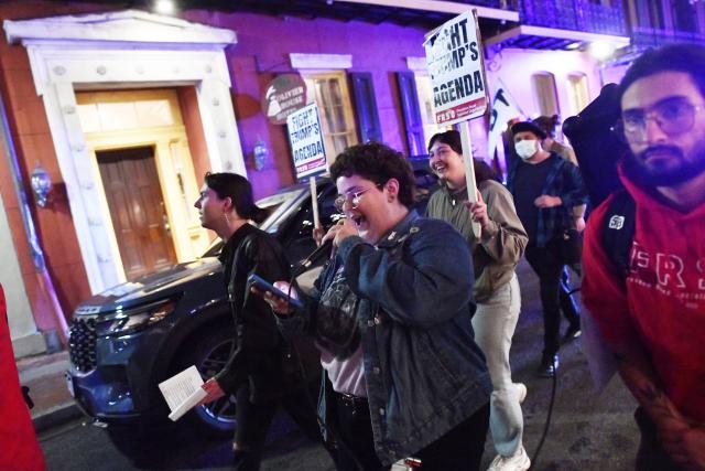 Protesters march through the French Quarter during a "No Trump, No Troops" rally against President Trump's immigration policies and Louisiana Governor Jeff Landry's National Guard deployment, in New Orleans, Louisiana on January 2, 2026. (Photo by Octavio JONES / AFP)