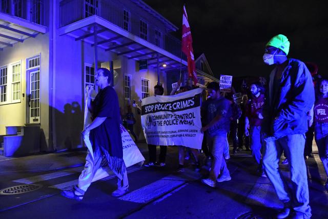 Protesters march through the French Quarter during a "No Trump, No Troops" rally against President Trump's immigration policies and Louisiana Governor Jeff Landry's National Guard deployment, in New Orleans, Louisiana on January 2, 2026. (Photo by Octavio JONES / AFP)