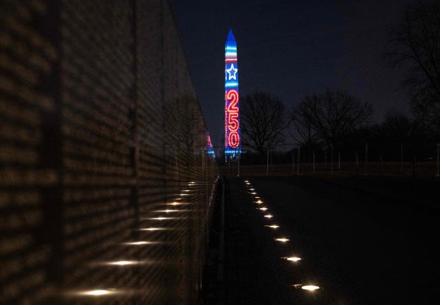 The numbers 250 are projected onto the Washington Monument, as seen from the Vietnam Veterans Memorial, during the "Illumination of America" event marking America’s 250th anniversary at the National Mall in Washington, DC, on January 2, 2026. (Photo by ANDREW CABALLERO-REYNOLDS / AFP)