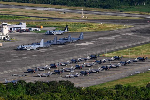 US military fighter jets sit on the tarmac at José Aponte de la Torre Airport, formerly Roosevelt Roads Naval Station, in Ceiba, Puerto Rico, on January 2, 2026. The United States has deployed a major military force in the Caribbean and has recently intercepted oil tankers as part of a naval blockade against Venezuelan vessels it considers to be under sanctions. Since September, US forces have launched dozens of air strikes on boats that Washington alleges, without showing evidence, were transporting drugs. More than 100 people have been killed. (Photo by Miguel J. Rodriguez Carrillo / AFP)