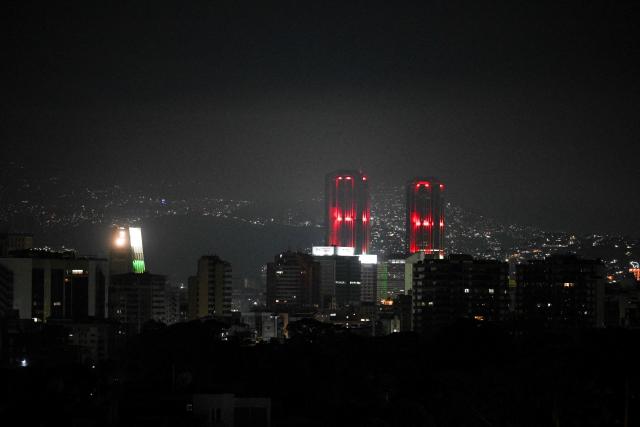Night view of Caracas taken after a series of explosions heard on January 3, 2026. Loud explosions, accompanied by sounds resembling aircraft flyovers, were heard in Caracas around 2:00 am (0600 GMT) on January 3, an AFP journalist reported. The explosions come as US President Donald Trump, who has deployed a navy task force to the Caribbean, raised the possibility of ground strikes against Venezuela. (Photo by Federico PARRA / AFP)