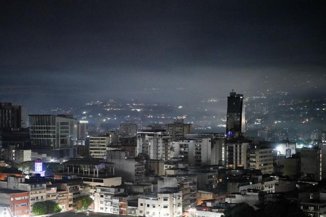 Night view of Caracas taken after a series of explosions heard on January 3, 2026. Loud explosions, accompanied by sounds resembling aircraft flyovers, were heard in Caracas around 2:00 am (0600 GMT) on January 3, an AFP journalist reported. The explosions come as US President Donald Trump, who has deployed a navy task force to the Caribbean, raised the possibility of ground strikes against Venezuela. (Photo by Federico PARRA / AFP)