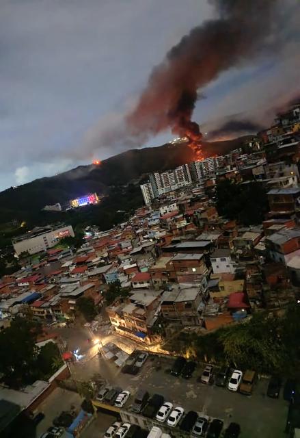 Fire is seen at Fuerte Tiuna, Venezuela's largest military complex, after a series of explosions in Caracas on January 3, 2026. The United States military was behind a series of strikes against the Venezuelan capital Caracas on Saturday, US media reported. The White House and Pentagon have not commented on the explosions and reports of aircraft over the city. US media outlets CBS News and Fox News reported unnamed Trump administration officials confirming that US forces were involved. (Photo by AFP)