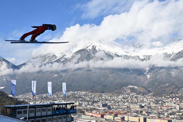 Finland's Antti Aalto soars through the air during the training round of the Men's Individual Large Hill HS128 event of the FIS Ski Jumping World Cup, the third leg of the Four Hills Tournament, in Innsbruck, Austria on January 3, 2026. (Photo by KERSTIN JOENSSON / AFP)
