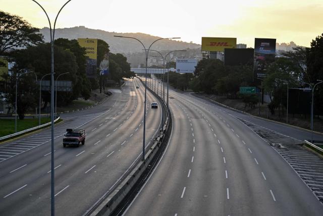 The Francisco Fajardo highway is seen almost empty in Caracas on January 3, 2026, after US forces captured Venezuelan leader Nicolas Maduro after launching a "large scale strike" on the South American country. (Photo by Juan BARRETO / AFP)