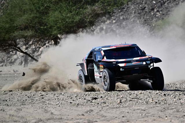 Dacia Sandriders French driver Sebastian Loeb and French co-driver Edouard Boulanger compete in the prologue, which determines the starting line-up for the first stage of the 48th edition of the Dakar Rally 2026, between Yanbu and Yanbu, Saudi Arabia, on January 3, 2026. (Photo by Giuseppe CACACE / AFP)