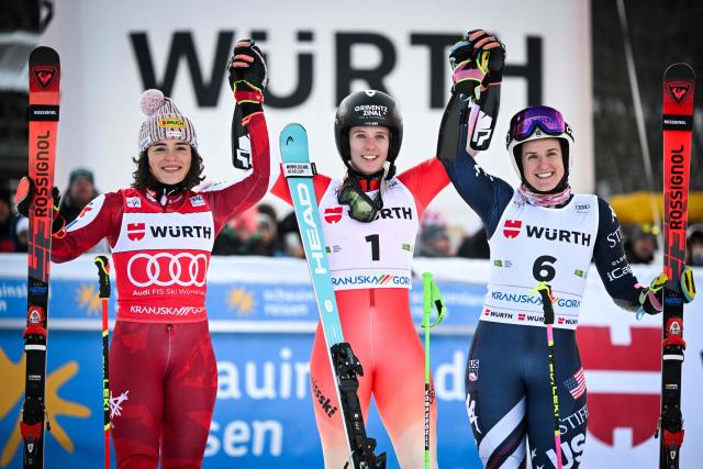 (From L) Second-placed Austria's Julia Scheib, first-placed Switzerland's Camille Rast and third-placed US' Paula Moltzan celebrate in the finish area after competing in the second run of the Women's Giant Slalom, part of the FIS Alpine Ski World Cup 2025-2026, in Kranjska Gora, Slovenia, on January 3, 2026. (Photo by Jure Makovec / AFP)
